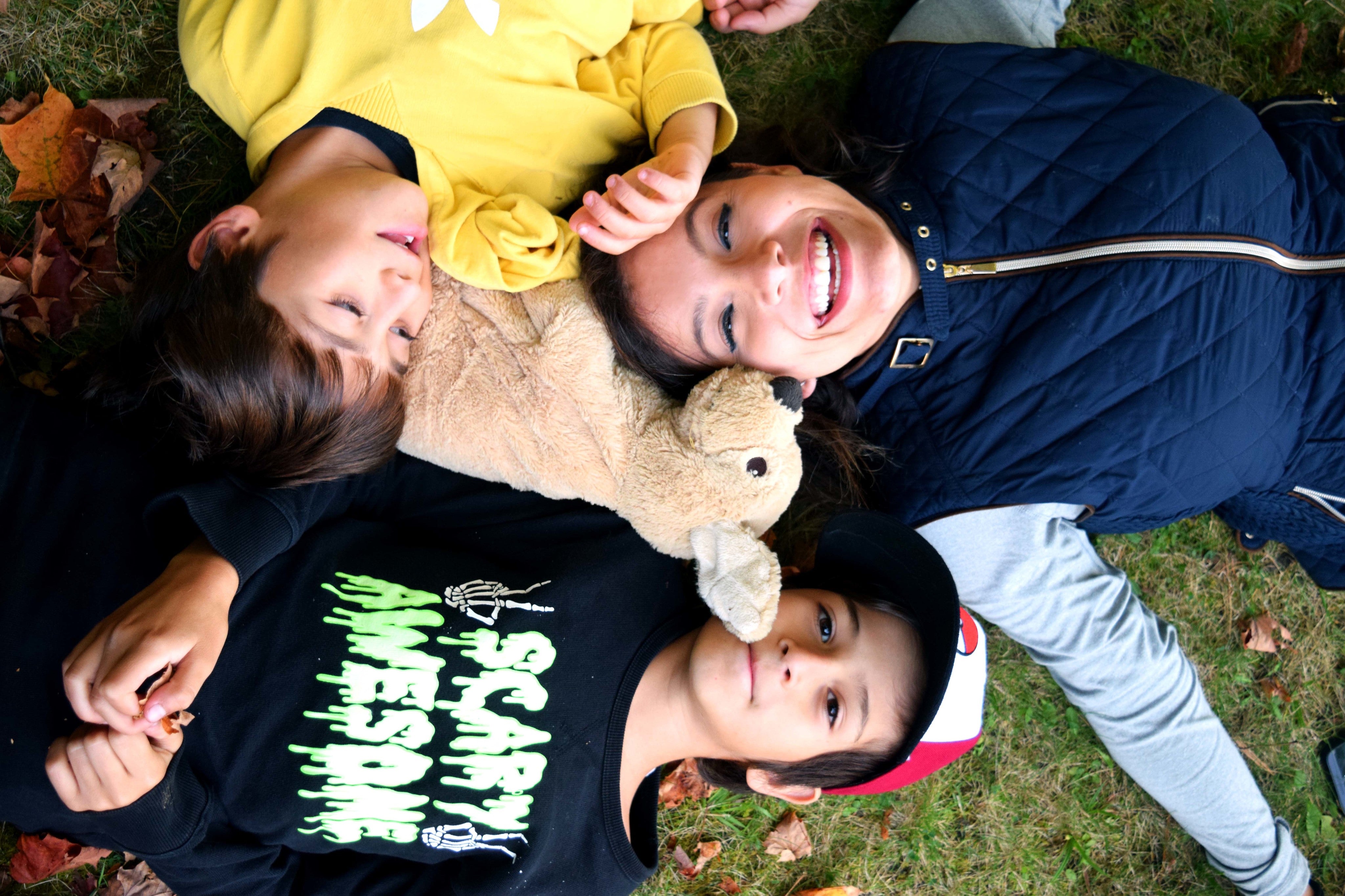 files/mother-laughing-with-her-children-in-grass.jpg