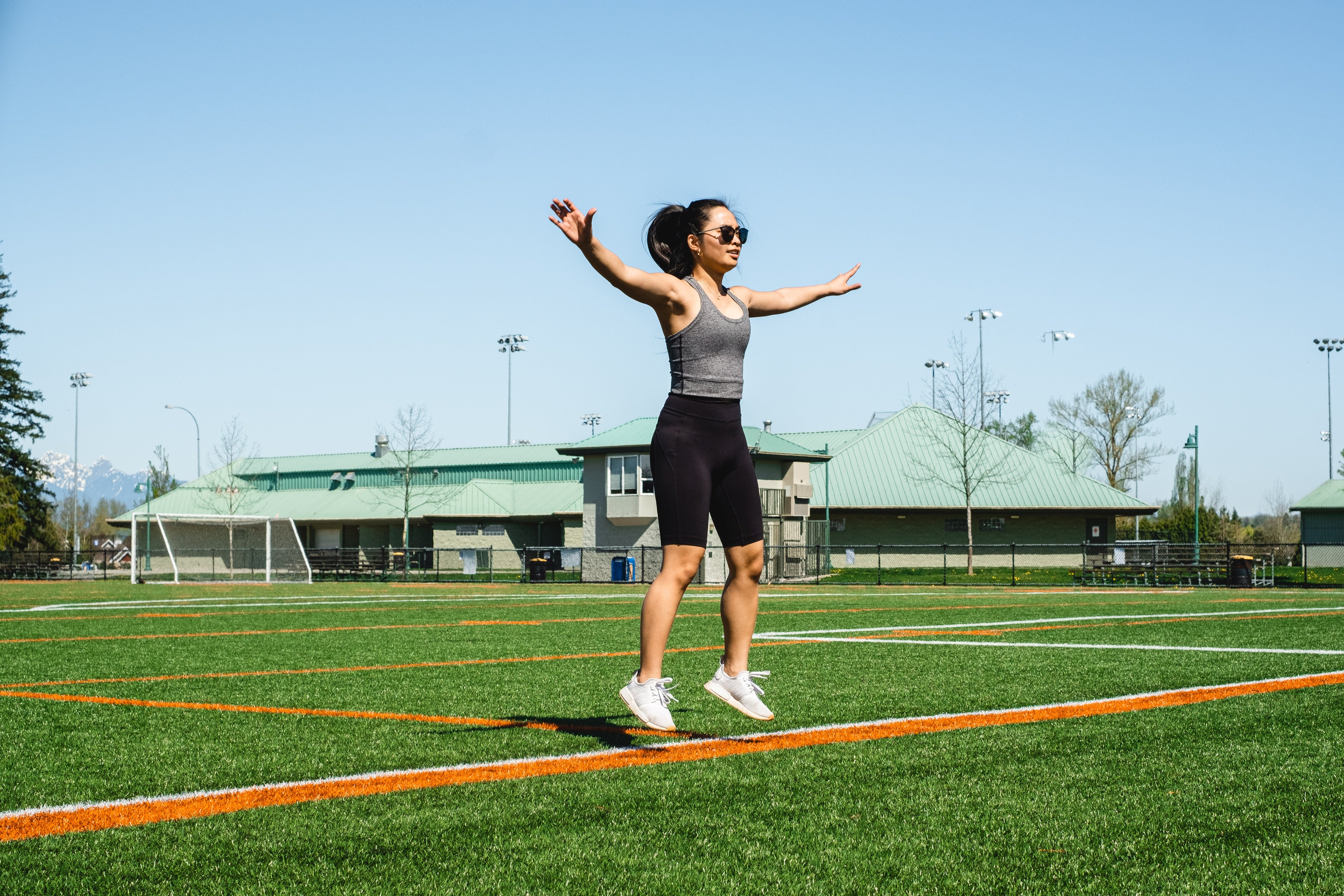 files/woman-mid-jumping-jack-floats-above-green-grass.jpg